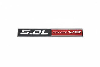 Car emblem with '5.0L COYOTE V8' text on a white background