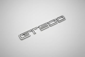 Metallic 'GT500' emblem on a white background