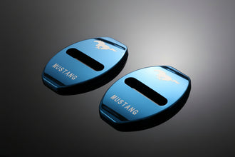 Two blue 'Mustang' branded car parts on a white background