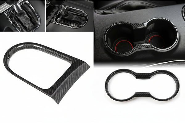Carbon fiber car interior accessories including a gear shift cover, cup holder, and frame.