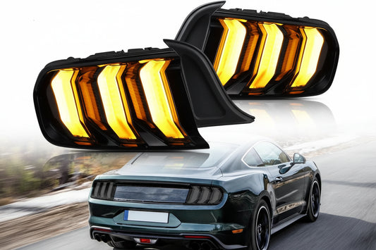 A pair of VLAND LED sequential tail lights for a Ford Mustang, showing the light patterns in bright amber, mounted on the rear of the vehicle.